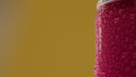 Close-Up-Shot-Of-Person-Picking-Up-And-Drinking-Can-Of-Cold-Beer-Or-Soft-Drink-With-Condensation-Droplets